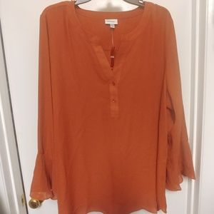 Tunic is spicy coral color. New with tags